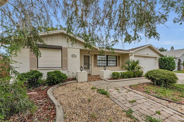 4143 Gray Squirrel Ln, New Port Richey, FL 34653 - ranch-style house featuring an attached garage, driveway, and brick siding