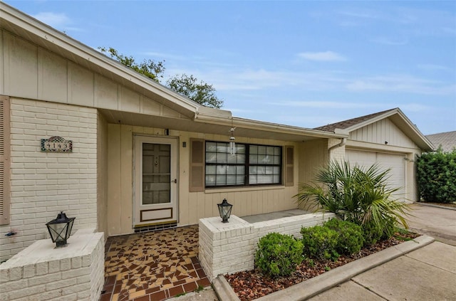 4143 Gray Squirrel Ln, New Port Richey, FL 34653 - property entrance featuring a garage, concrete driveway, and brick siding
