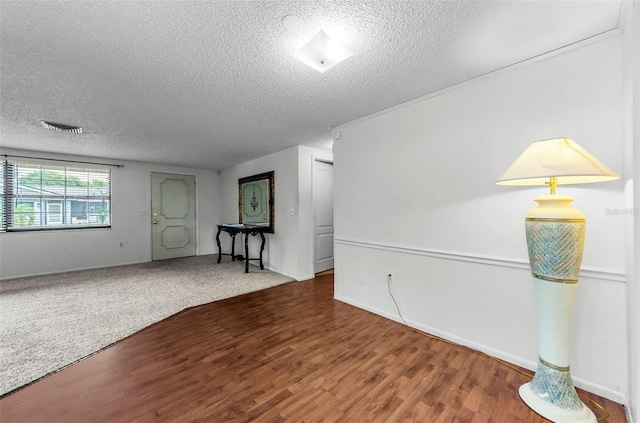 4143 Gray Squirrel Ln, New Port Richey, FL 34653 - spare room with a textured ceiling and wood finished floors