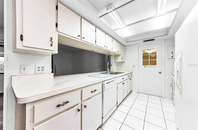 4143 Gray Squirrel Ln, New Port Richey, FL 34653 - kitchen with white appliances, light countertops, light tile patterned flooring, and white cabinetry