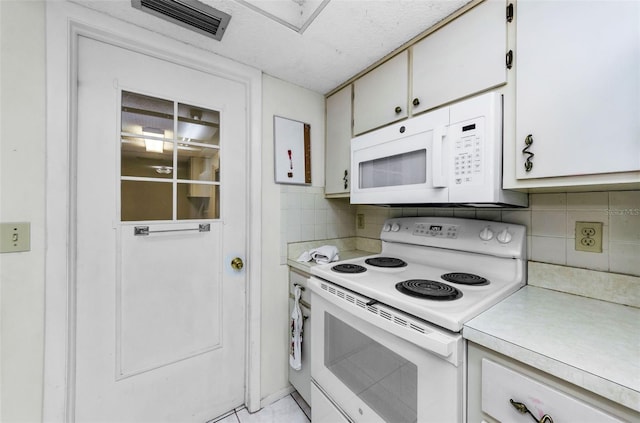 4143 Gray Squirrel Ln, New Port Richey, FL 34653 - kitchen with white appliances, light countertops, tasteful backsplash, and white cabinets