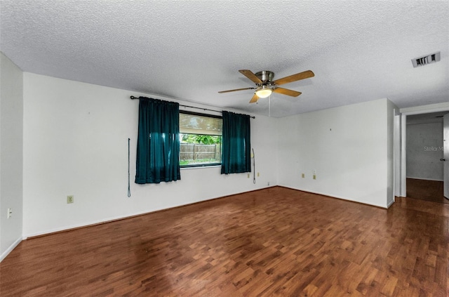4143 Gray Squirrel Ln, New Port Richey, FL 34653 - unfurnished room featuring wood finished floors, ceiling fan, and a textured ceiling