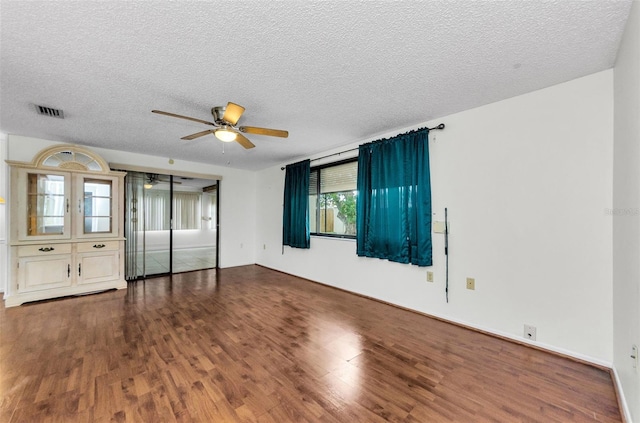 4143 Gray Squirrel Ln, New Port Richey, FL 34653 - spare room featuring a ceiling fan, wood finished floors, and a textured ceiling