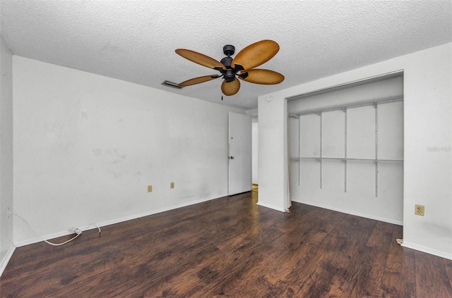4143 Gray Squirrel Ln, New Port Richey, FL 34653 - unfurnished bedroom with wood finished floors, a closet, ceiling fan, and a textured ceiling