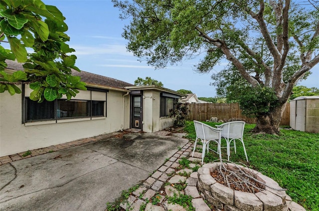 4143 Gray Squirrel Ln, New Port Richey, FL 34653 - view of patio / terrace with an outdoor fire pit