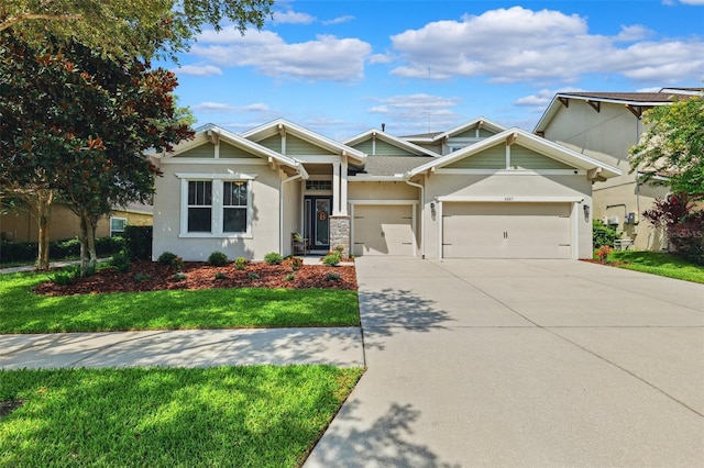 6007 Quartz Lake Way, Lithia, FL 33547 - view of front facade featuring concrete driveway, stucco siding, a garage, and a front yard