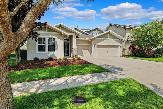 6007 Quartz Lake Way, Lithia, FL 33547 - view of front of property featuring stucco siding, concrete driveway, an attached garage, and a front yard