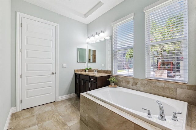6007 Quartz Lake Way, Lithia, FL 33547 - full bath featuring vanity, a garden tub, and plenty of natural light