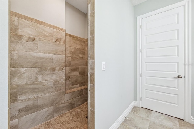 6007 Quartz Lake Way, Lithia, FL 33547 - bathroom with tiled shower and baseboards