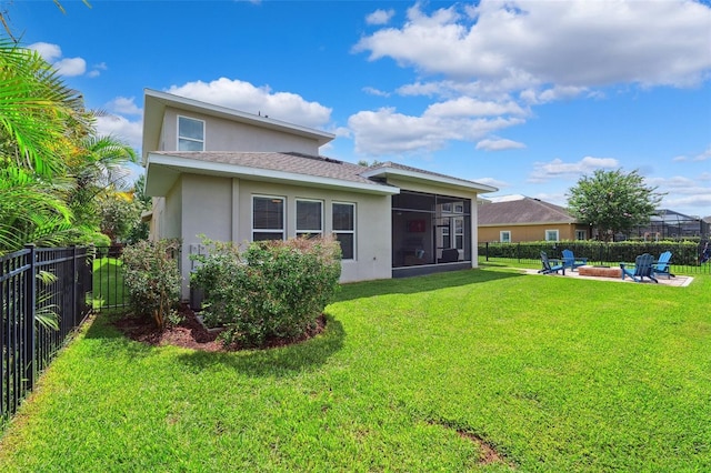 6007 Quartz Lake Way, Lithia, FL 33547 - rear view of property with an outdoor fire pit, stucco siding, a fenced backyard, a sunroom, and a shingled roof