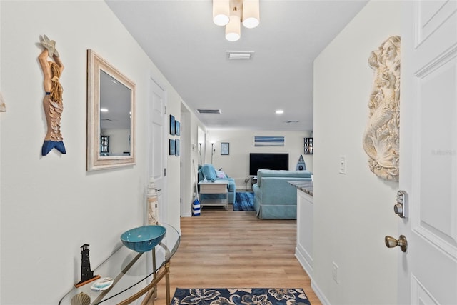 4252 Floramar Ter, New Port Richey, FL 34652 - hall with light wood-type flooring and recessed lighting