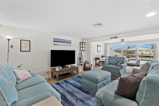 4252 Floramar Ter, New Port Richey, FL 34652 - living area with wood finished floors, a ceiling fan, and recessed lighting