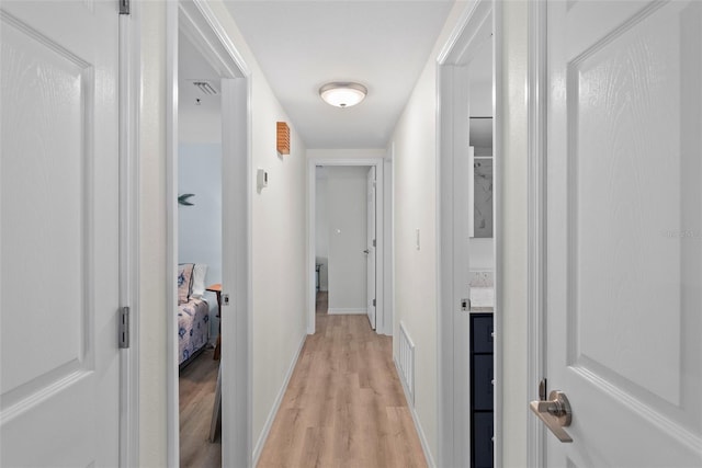 4252 Floramar Ter, New Port Richey, FL 34652 - hall featuring light wood-type flooring and baseboards