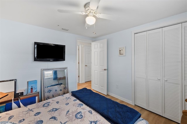 4252 Floramar Ter, New Port Richey, FL 34652 - bedroom with wood finished floors, a closet, and a ceiling fan