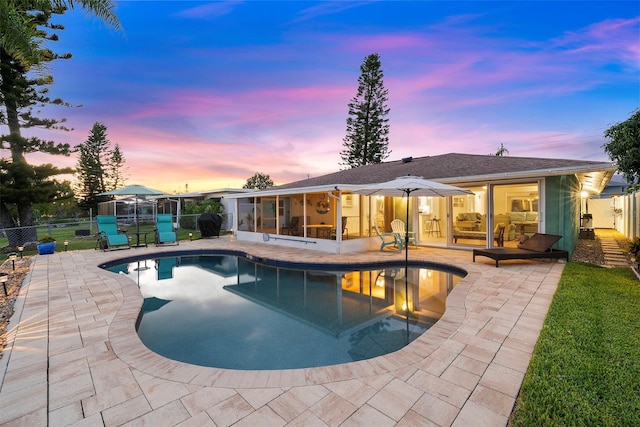 4252 Floramar Ter, New Port Richey, FL 34652 - view of swimming pool with a sunroom and a patio