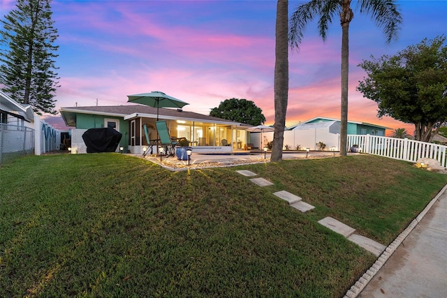 4252 Floramar Ter, New Port Richey, FL 34652 - rear view of house featuring a patio and a fenced backyard
