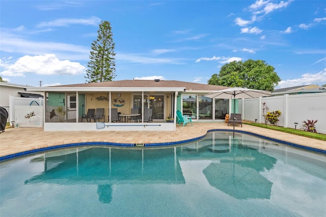 4252 Floramar Ter, New Port Richey, FL 34652 - rear view of property with a sunroom and a patio area