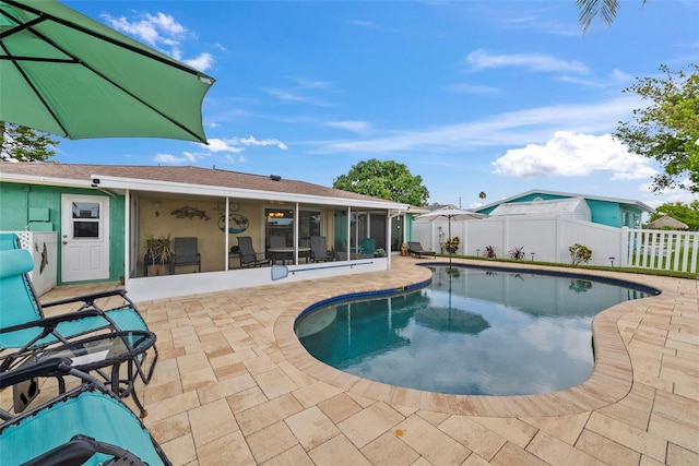 4252 Floramar Ter, New Port Richey, FL 34652 - view of pool with a fenced backyard, a patio area, and a sunroom