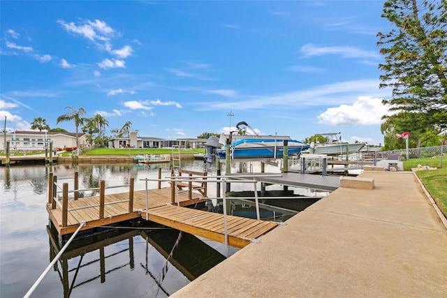 4252 Floramar Ter, New Port Richey, FL 34652 - dock area with boat lift, a water view, and a residential view