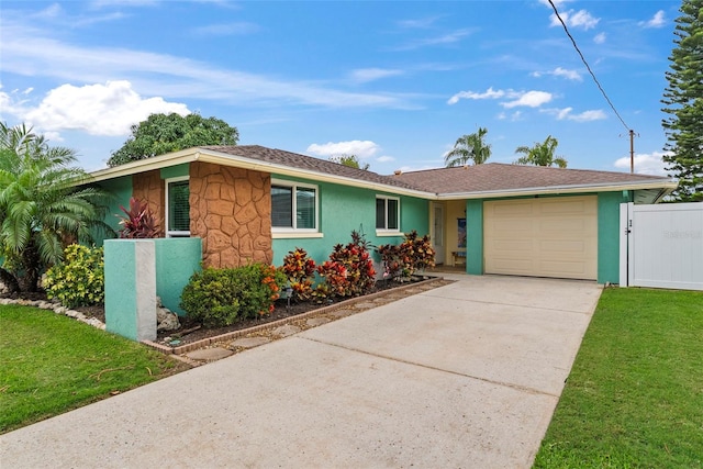 4252 Floramar Ter, New Port Richey, FL 34652 - single story home with a garage, stucco siding, and driveway