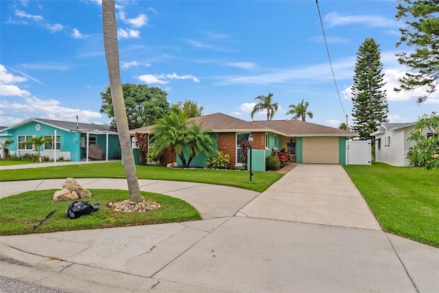 4252 Floramar Ter, New Port Richey, FL 34652 - single story home with curved driveway, a front lawn, a garage, and a gate