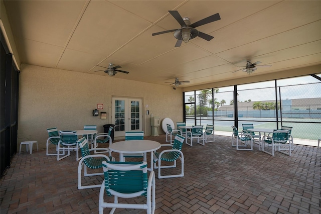 4252 Floramar Ter, New Port Richey, FL 34652 - view of patio featuring french doors, ceiling fan, and outdoor dining area