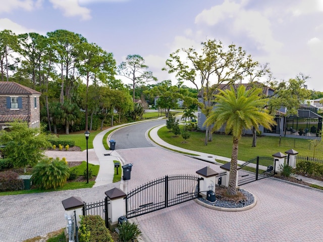 7849 Marsh Pointe Dr, Tampa, FL 33635 - view of property's community featuring a gate and curved driveway