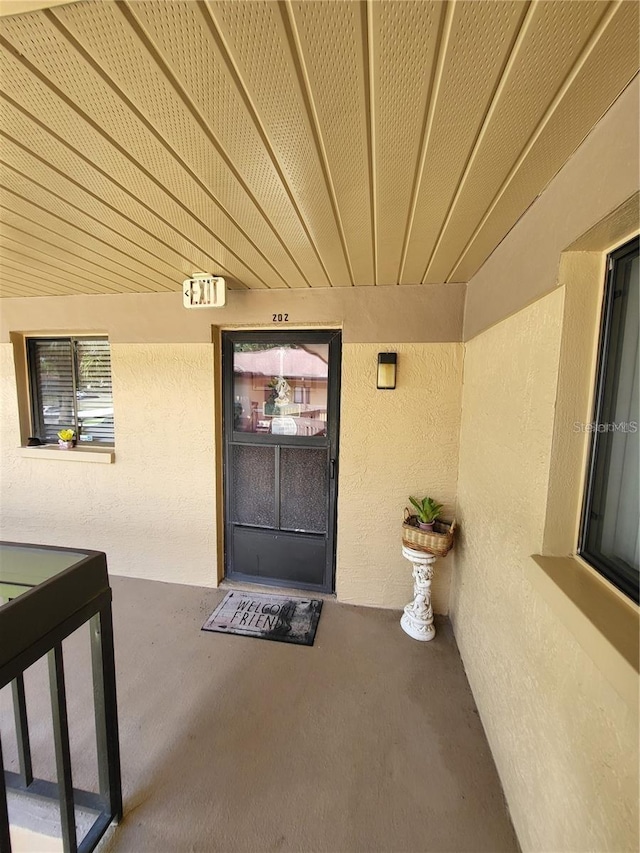 2685 Sabal Springs Cir Unit 202, Clearwater, FL 33761 - view of exterior entry with stucco siding