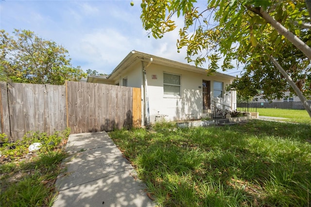 1919 Dr Martin Luther King Jr St S Unit J, Saint Petersburg, FL 33705 - view of front of property with stucco siding and entry steps