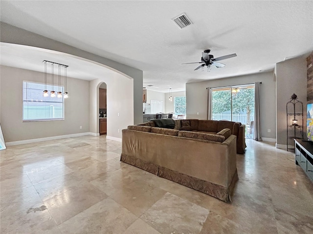 4079 Pacente Loop, Wesley Chapel, FL 33543 - living room with ceiling fan and arched walkways