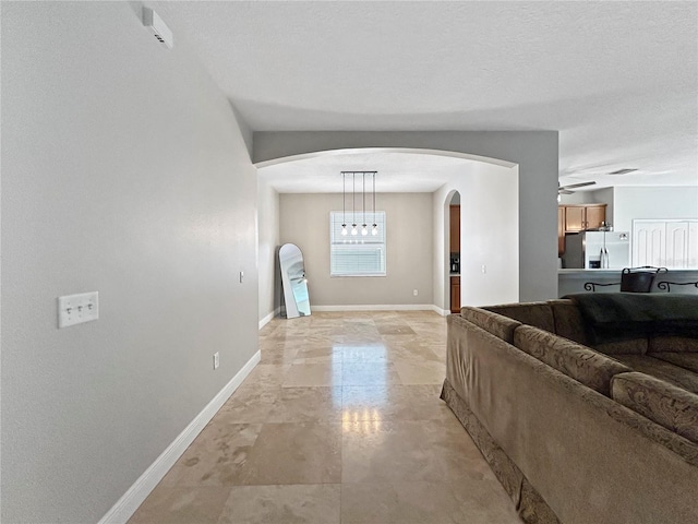 4079 Pacente Loop, Wesley Chapel, FL 33543 - hall with arched walkways and baseboards