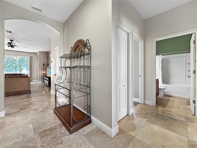 4079 Pacente Loop, Wesley Chapel, FL 33543 - corridor featuring arched walkways and baseboards