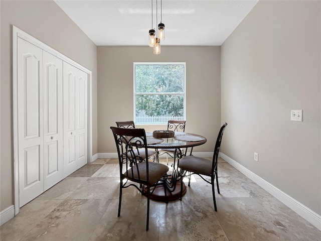 4079 Pacente Loop, Wesley Chapel, FL 33543 - dining room featuring baseboards and light stone finish floors