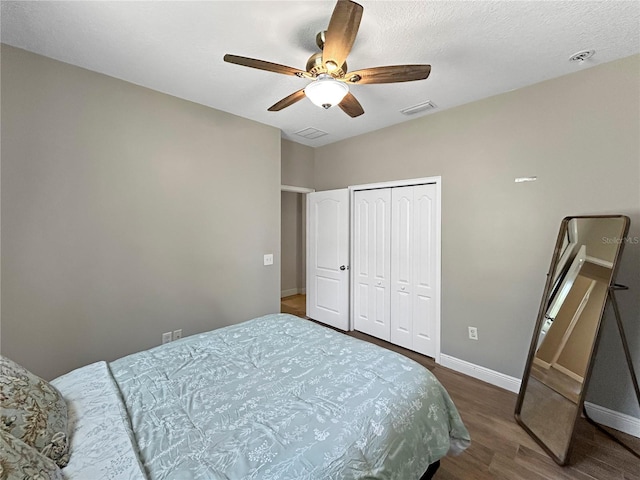 4079 Pacente Loop, Wesley Chapel, FL 33543 - bedroom featuring wood finished floors, a closet, and a ceiling fan