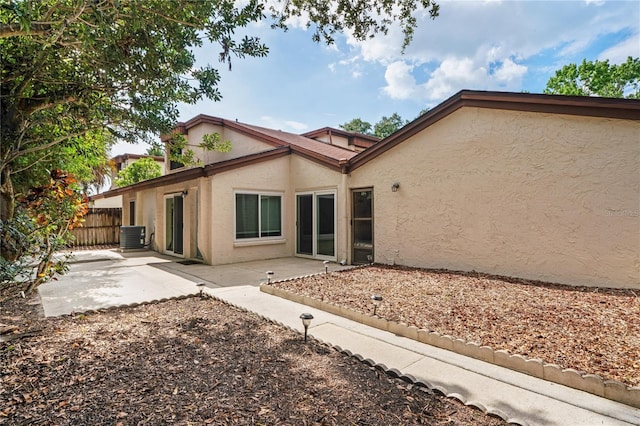2095 Sunset Point Rd Unit 2201, Clearwater, FL 33765 - rear view of house featuring stucco siding and a patio
