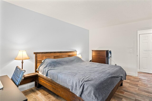 2095 Sunset Point Rd Unit 2201, Clearwater, FL 33765 - bedroom featuring wood finished floors