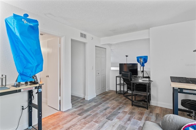 2095 Sunset Point Rd Unit 2201, Clearwater, FL 33765 - office space with light wood-style flooring and a textured ceiling