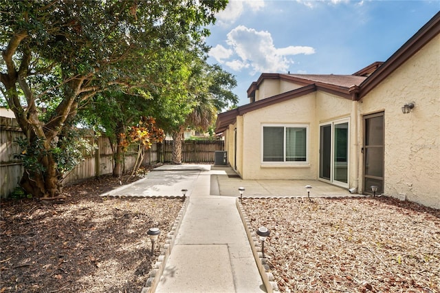 2095 Sunset Point Rd Unit 2201, Clearwater, FL 33765 - fenced backyard featuring a patio