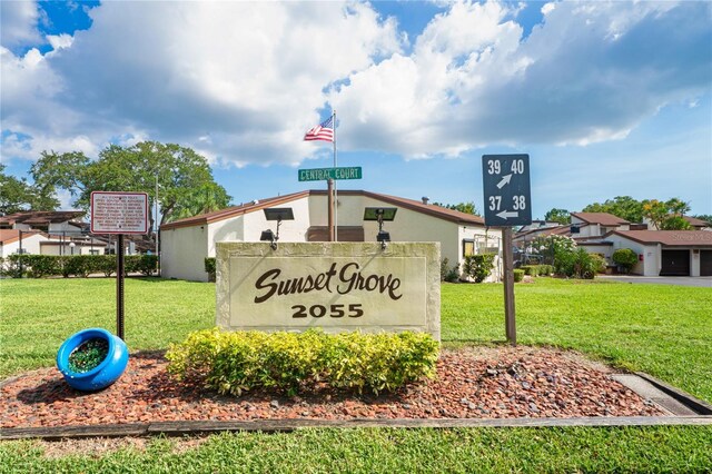 2095 Sunset Point Rd Unit 2201, Clearwater, FL 33765 - community / neighborhood sign featuring a yard