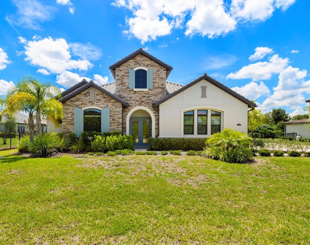 2839 Cordoba Ranch Blvd, Lutz, FL 33559 - view of front of house featuring french doors, stone siding, and stucco siding