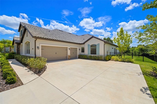2839 Cordoba Ranch Blvd, Lutz, FL 33559 - mediterranean / spanish home with an attached garage, stucco siding, concrete driveway, and a tile roof