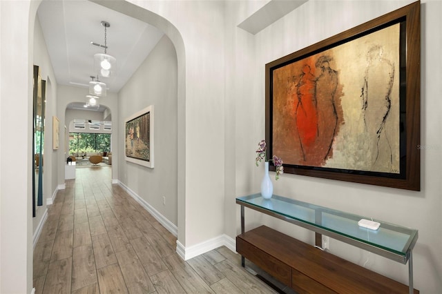 2839 Cordoba Ranch Blvd, Lutz, FL 33559 - hall with arched walkways and wood finished floors