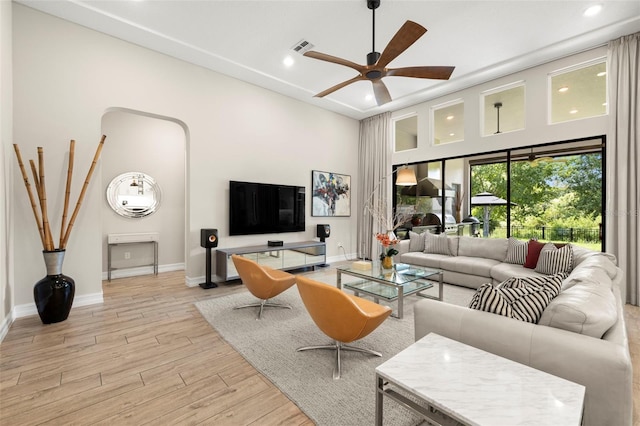 2839 Cordoba Ranch Blvd, Lutz, FL 33559 - living area with a ceiling fan, light wood-style flooring, recessed lighting, and a high ceiling