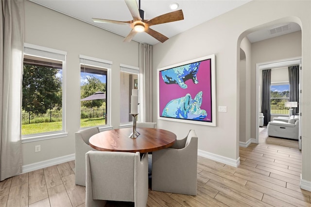 2839 Cordoba Ranch Blvd, Lutz, FL 33559 - dining area featuring arched walkways, light wood-style flooring, and ceiling fan