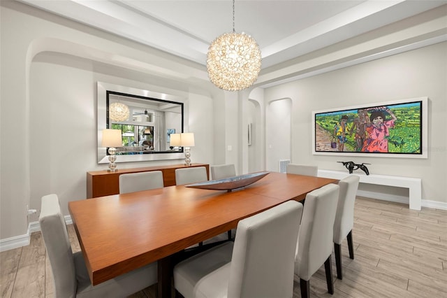 2839 Cordoba Ranch Blvd, Lutz, FL 33559 - dining area with a chandelier and light wood-style floors