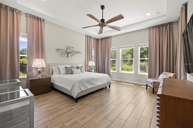 2839 Cordoba Ranch Blvd, Lutz, FL 33559 - bedroom featuring a tray ceiling, light wood-style floors, ceiling fan, and recessed lighting