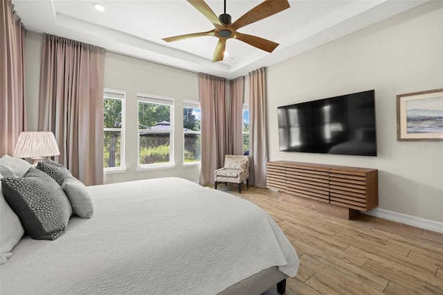 2839 Cordoba Ranch Blvd, Lutz, FL 33559 - bedroom with a raised ceiling, wood finished floors, ceiling fan, and recessed lighting