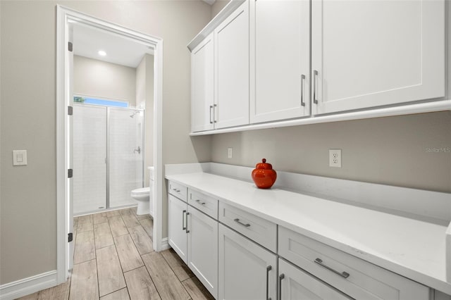 2839 Cordoba Ranch Blvd, Lutz, FL 33559 - bathroom with a stall shower, wood tiled floors, and vanity