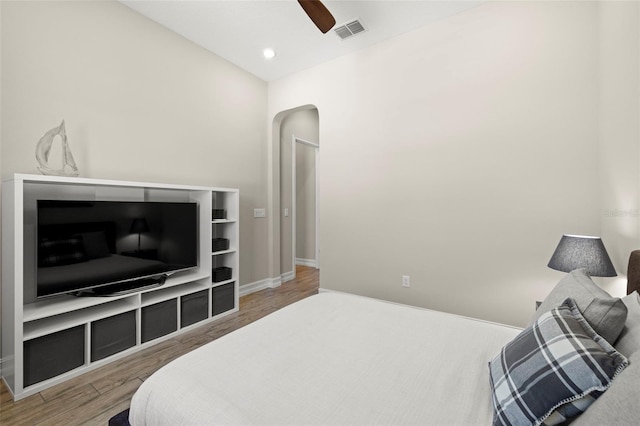 2839 Cordoba Ranch Blvd, Lutz, FL 33559 - bedroom featuring light wood finished floors, arched walkways, and a ceiling fan