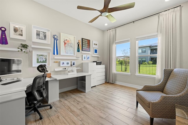 2839 Cordoba Ranch Blvd, Lutz, FL 33559 - home office featuring light wood-style flooring, built in desk, ceiling fan, and recessed lighting